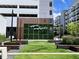 Modern Upper Westside building with green wall decor and landscaped green space at 2244 Spink Nw St, Atlanta, GA 30318