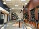 The Woodall's interior is artistic, with a beautiful mural and inviting seating arrangements at 2244 Spink Nw St, Atlanta, GA 30318