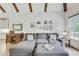 Comfortable living room with hardwood floors, a gray sectional, wood accents, natural light, and stylish decor at 2244 Spink Nw St, Atlanta, GA 30318