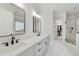 Main bathroom with dual sinks, modern fixtures, and a glass-enclosed shower at 2244 Spink Nw St, Atlanta, GA 30318