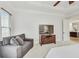 Bright main bedroom with a sitting area and views of the backyard at 2244 Spink Nw St, Atlanta, GA 30318