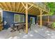Relaxing covered patio with outdoor dining set, perfect for entertaining and Gathering gatherings at 2244 Spink Nw St, Atlanta, GA 30318