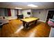 Finished basement with pool table, bar area and TV for entertaining guests at 6147 Pritchett Dr, Powder Springs, GA 30127