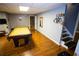 Basement featuring a pool table, hardwood floors, and access to stairs at 6147 Pritchett Dr, Powder Springs, GA 30127