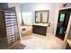 A luxurious bathroom featuring double vanity, walk-in shower, and jetted tub at 6147 Pritchett Dr, Powder Springs, GA 30127
