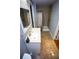Bathroom featuring a shower with tile walls, a sink, and neutral paint at 6147 Pritchett Dr, Powder Springs, GA 30127