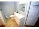 Bathroom featuring a vanity with a sink, toilet, and vinyl flooring at 6147 Pritchett Dr, Powder Springs, GA 30127
