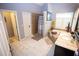 Bathroom featuring a shower, soaker tub and double sink vanity at 6147 Pritchett Dr, Powder Springs, GA 30127