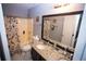 Bathroom features a vanity with granite countertops and a shower-tub combination at 6147 Pritchett Dr, Powder Springs, GA 30127