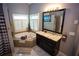 Bathroom boasting granite counters, tub, walk-in shower, and plenty of storage at 6147 Pritchett Dr, Powder Springs, GA 30127