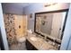 Bathroom featuring granite countertop, double sink vanity and shower-tub combination at 6147 Pritchett Dr, Powder Springs, GA 30127