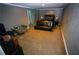 Cozy bedroom featuring neutral walls, carpet flooring and a comfortable futon bed at 6147 Pritchett Dr, Powder Springs, GA 30127