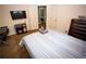 Comfortable carpeted bedroom with plentiful closet space and study area at 6147 Pritchett Dr, Powder Springs, GA 30127