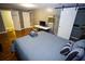 Bedroom with hardwood floors, gray walls, and a sliding barn door at 6147 Pritchett Dr, Powder Springs, GA 30127