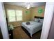 Bright bedroom features a ceiling fan and a large window for natural light at 6147 Pritchett Dr, Powder Springs, GA 30127