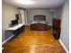 The bedroom features hard wood floors, a modern desk and dresser, and great lighting at 6147 Pritchett Dr, Powder Springs, GA 30127