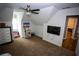 Bright bedroom with plush carpet, a ceiling fan, and good natural light at 6147 Pritchett Dr, Powder Springs, GA 30127