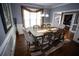Stylish dining room featuring a wooden table, seating for eight, and large window offering bright natural light at 6147 Pritchett Dr, Powder Springs, GA 30127