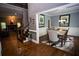 Elegant dining room showcasing hardwood floors and open floorplan at 6147 Pritchett Dr, Powder Springs, GA 30127