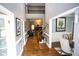 Inviting foyer with hardwood floors, staircase, and view into the living and dining rooms at 6147 Pritchett Dr, Powder Springs, GA 30127