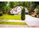 Charming two-story home with well-maintained lawn and a dark-colored attached garage at 6147 Pritchett Dr, Powder Springs, GA 30127