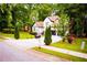 Inviting home exterior featuring a lush front lawn and a long driveway at 6147 Pritchett Dr, Powder Springs, GA 30127