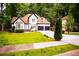 Inviting home with a well-maintained lawn, lovely landscaping, and a two-car garage at 6147 Pritchett Dr, Powder Springs, GA 30127