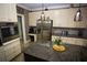 Bright kitchen featuring a stainless refrigerator, pendant lighting, and an island at 6147 Pritchett Dr, Powder Springs, GA 30127