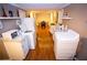 Bright kitchen with white cabinetry, modern appliances, and hardwood flooring at 6147 Pritchett Dr, Powder Springs, GA 30127