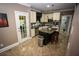 Modern kitchen featuring an island, stainless steel appliances, and granite countertops for cooking convenience at 6147 Pritchett Dr, Powder Springs, GA 30127