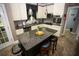 Stylish kitchen featuring an island with seating, stainless appliances, and plenty of counter space at 6147 Pritchett Dr, Powder Springs, GA 30127