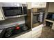 Close-up of kitchen appliances shows cooktop and oven at 6147 Pritchett Dr, Powder Springs, GA 30127