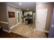 Bright kitchen features a center island, tile floors, and modern appliances at 6147 Pritchett Dr, Powder Springs, GA 30127