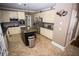 Bright kitchen with an island, stainless appliances, and ample cabinet space for convenient storage at 6147 Pritchett Dr, Powder Springs, GA 30127