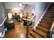 Comfortable living room showcasing a fireplace, hardwood floors, and a staircase to the upper level at 6147 Pritchett Dr, Powder Springs, GA 30127