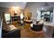 Cozy living room with fireplace and seamless flow to the kitchen at 6147 Pritchett Dr, Powder Springs, GA 30127