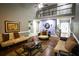 Open-concept living room with high ceilings and staircase, offering ample natural light at 6147 Pritchett Dr, Powder Springs, GA 30127