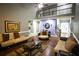 Bright living room with hardwood floors and comfortable seating arrangement at 6147 Pritchett Dr, Powder Springs, GA 30127