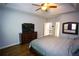 Spacious main bedroom boasts hardwood floors, a tray ceiling, and generous natural light at 6147 Pritchett Dr, Powder Springs, GA 30127