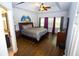 Spacious main bedroom with ceiling fan and en suite bathroom at 6147 Pritchett Dr, Powder Springs, GA 30127