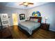 Spacious main bedroom boasts hardwood floors, a tray ceiling, and generous natural light at 6147 Pritchett Dr, Powder Springs, GA 30127