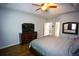 Main bedroom with en suite bathroom, hard wood floors and ceiling fan at 6147 Pritchett Dr, Powder Springs, GA 30127