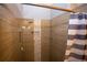 Detailed shot of the tiled walk-in shower featuring built in niche for toiletries at 6147 Pritchett Dr, Powder Springs, GA 30127