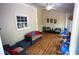 Bright sunroom with wood flooring and comfortable seating, perfect for relaxing and entertaining at 6147 Pritchett Dr, Powder Springs, GA 30127