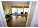 Bright sunroom with many windows and wood flooring, creating a warm and inviting space at 6147 Pritchett Dr, Powder Springs, GA 30127