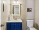 Well-lit bathroom with vanity and toilet at 682 Leighton Way, Stone Mountain, GA 30088