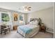 Bright bedroom with natural light, a cozy bed, and charming decorative elements at 682 Leighton Way, Stone Mountain, GA 30088