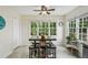 Eat-in kitchen with breakfast table and bench seating with natural light at 682 Leighton Way, Stone Mountain, GA 30088