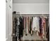 Walk-in closet with ample hanging space and a shelf for shoes and accessories at 682 Leighton Way, Stone Mountain, GA 30088