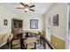 Charming dining room featuring a corner cabinet, natural light, and seating for four at 682 Leighton Way, Stone Mountain, GA 30088